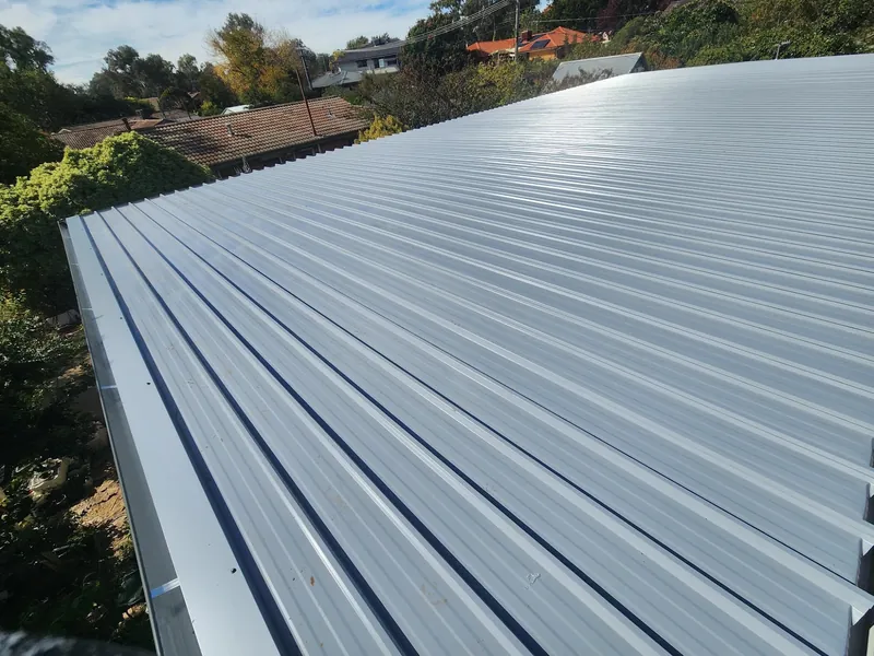 Finished pale Colorbond roof sheeting with clean gutters