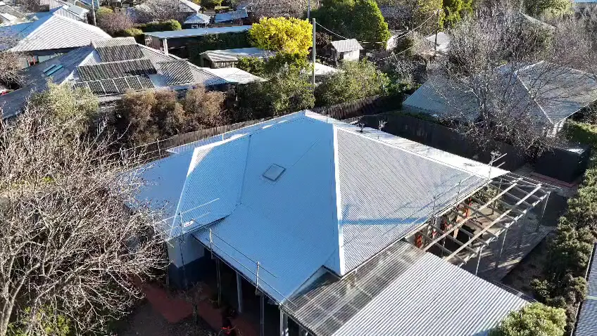 Drone view of a new Colorbond roof surrounded by trees